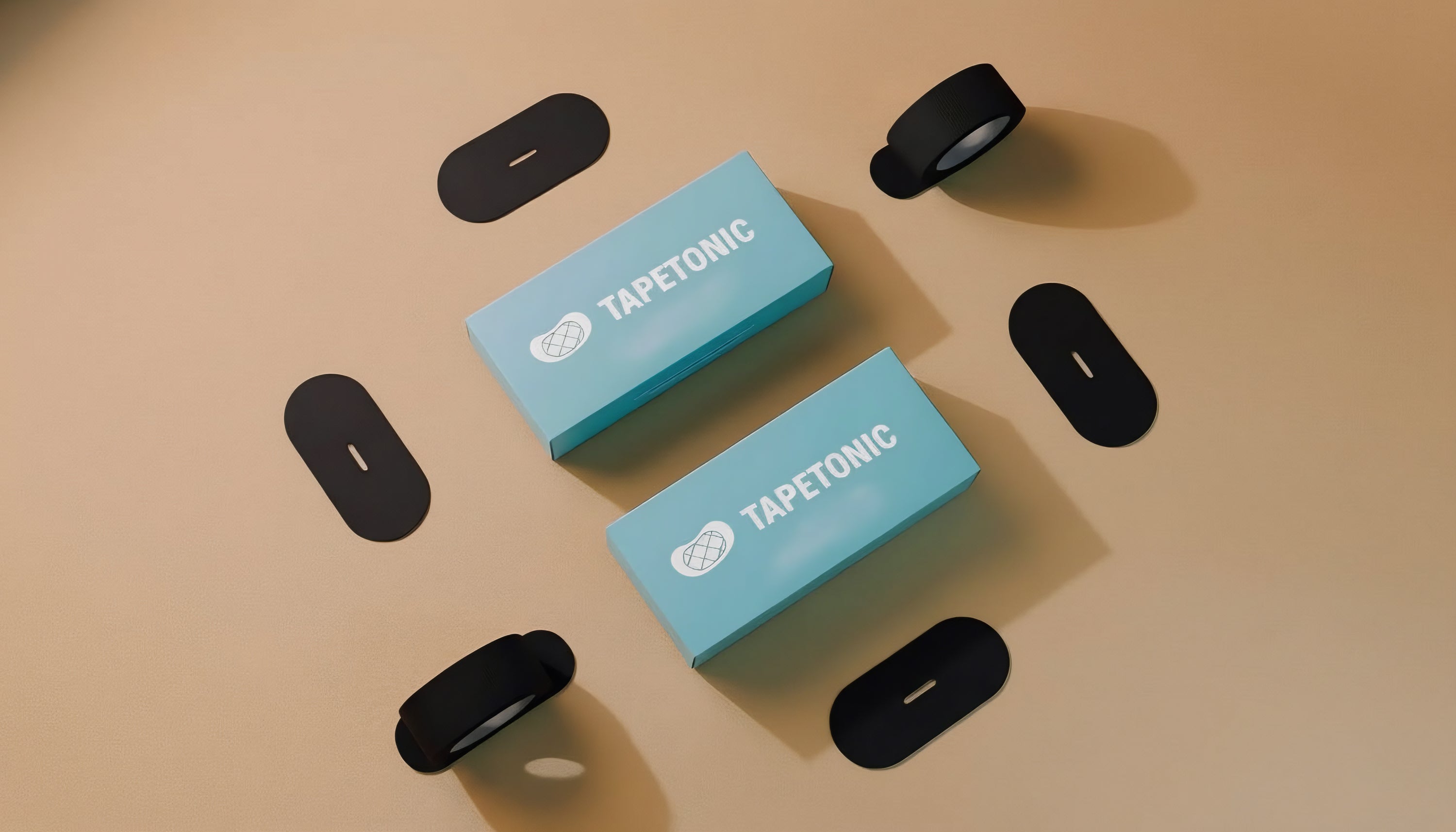 Two blue boxes with 'Tapetonic' branding on a beige background